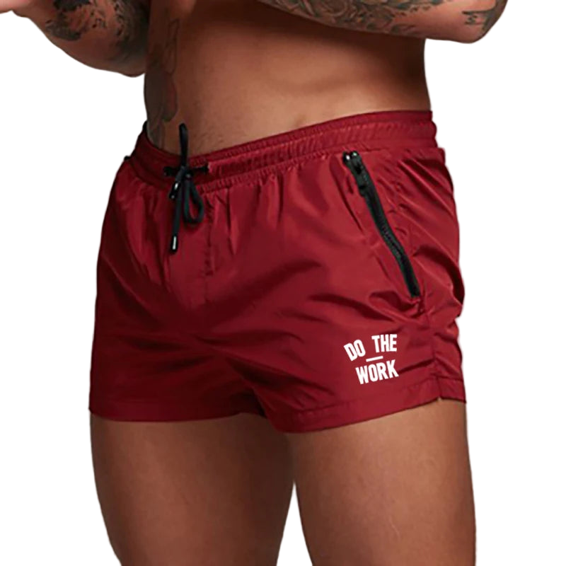 Red shorts with 'Do The Work' text on a plain background