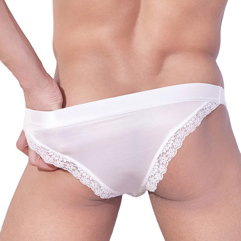 White lace-trimmed underwear on a neutral background